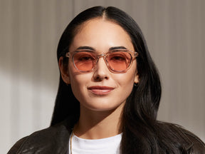 Model is wearing The DAVHEN in Mist in size 47 with New York Rose Tinted Lenses