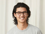 Model is wearing The ARTHUR CLIP in Brass in size 48 with Blue Protect Lenses