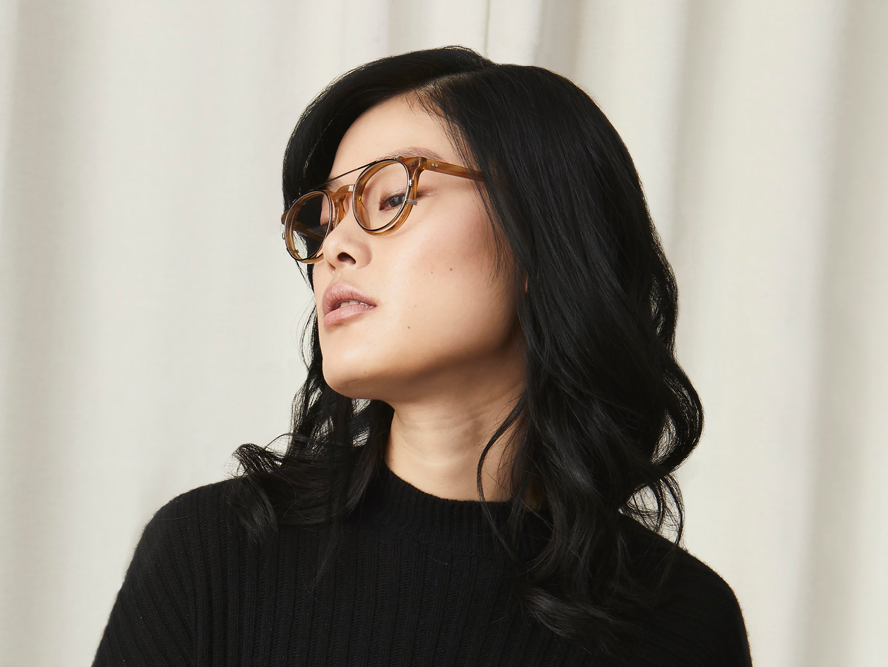 Model is wearing The FRANKIE CLIP in Brass in size 51 with Blue Protect Lenses