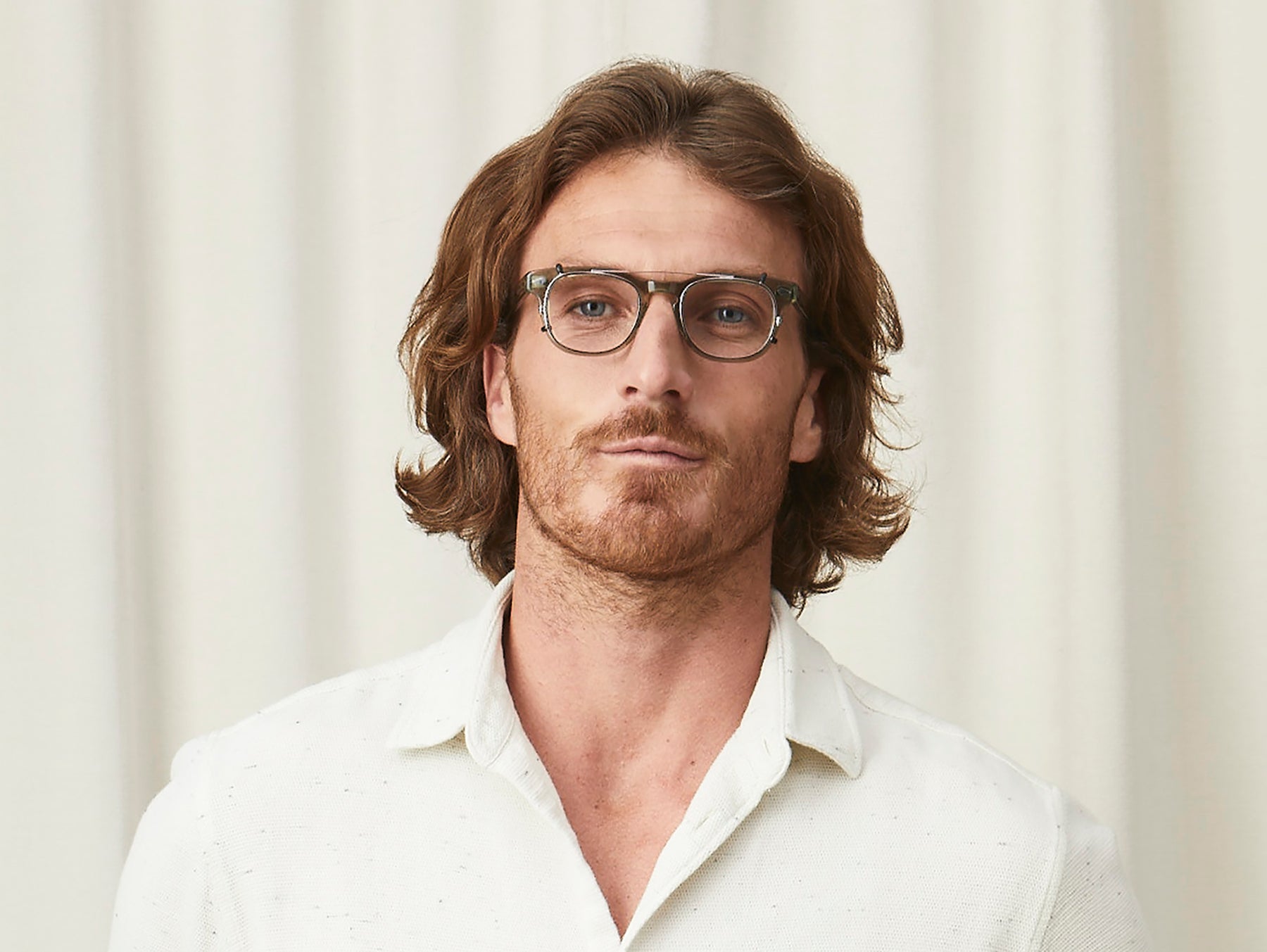 Model is wearing The GELT CLIP in Pewter in size 46 with Blue Protect Lenses