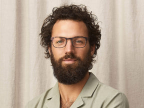 The Model is wearing The NEBB-T in Tortoise/Pine in size 51 with Blue Light Filter Lenses