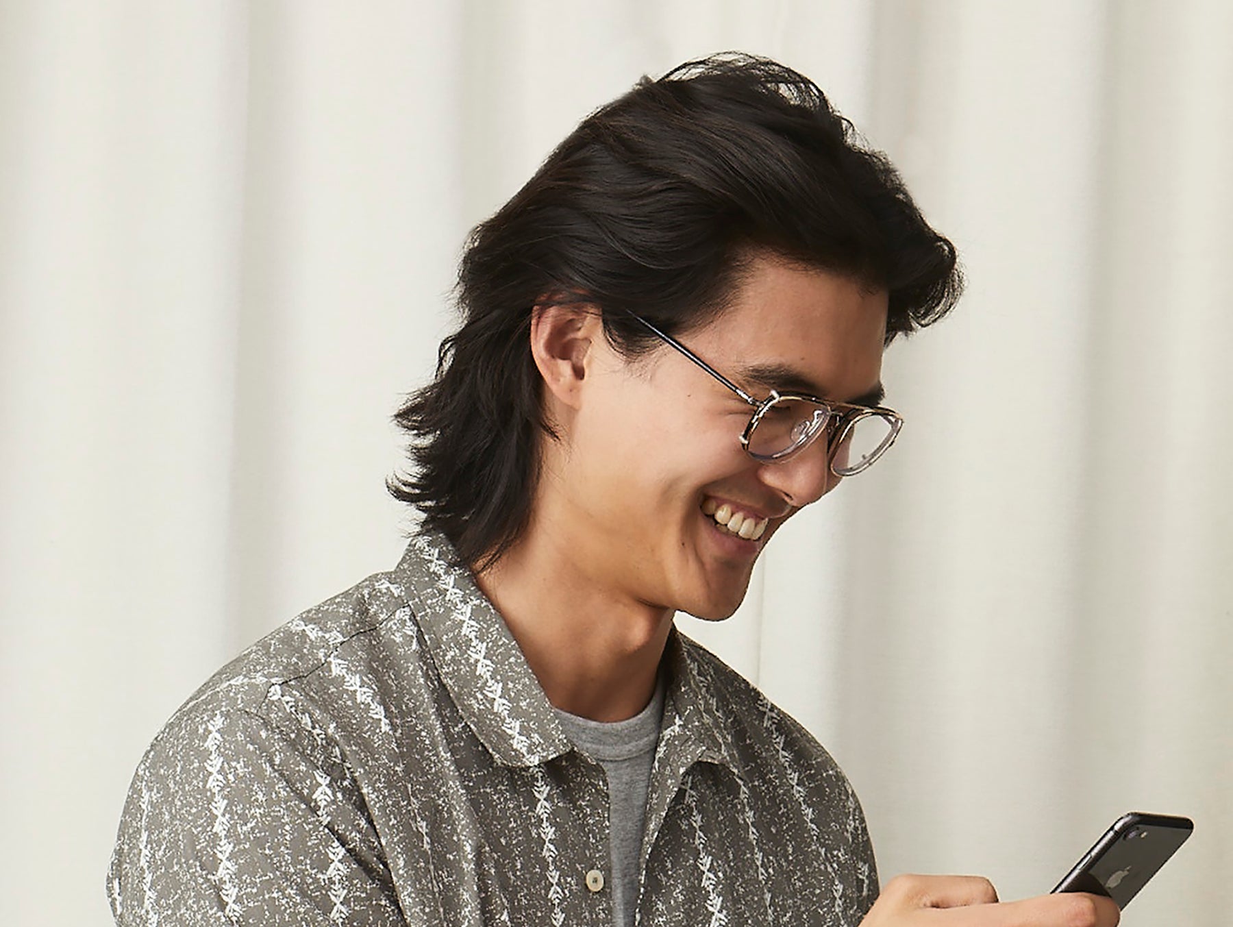 Model is wearing The SCHLEP CLIP in Gold in size 50 with Blue Protect Lenses