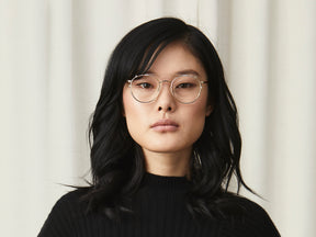 Model is wearing The ZEV CLIP in Gold in Size 49 with Blue Protect Lenses