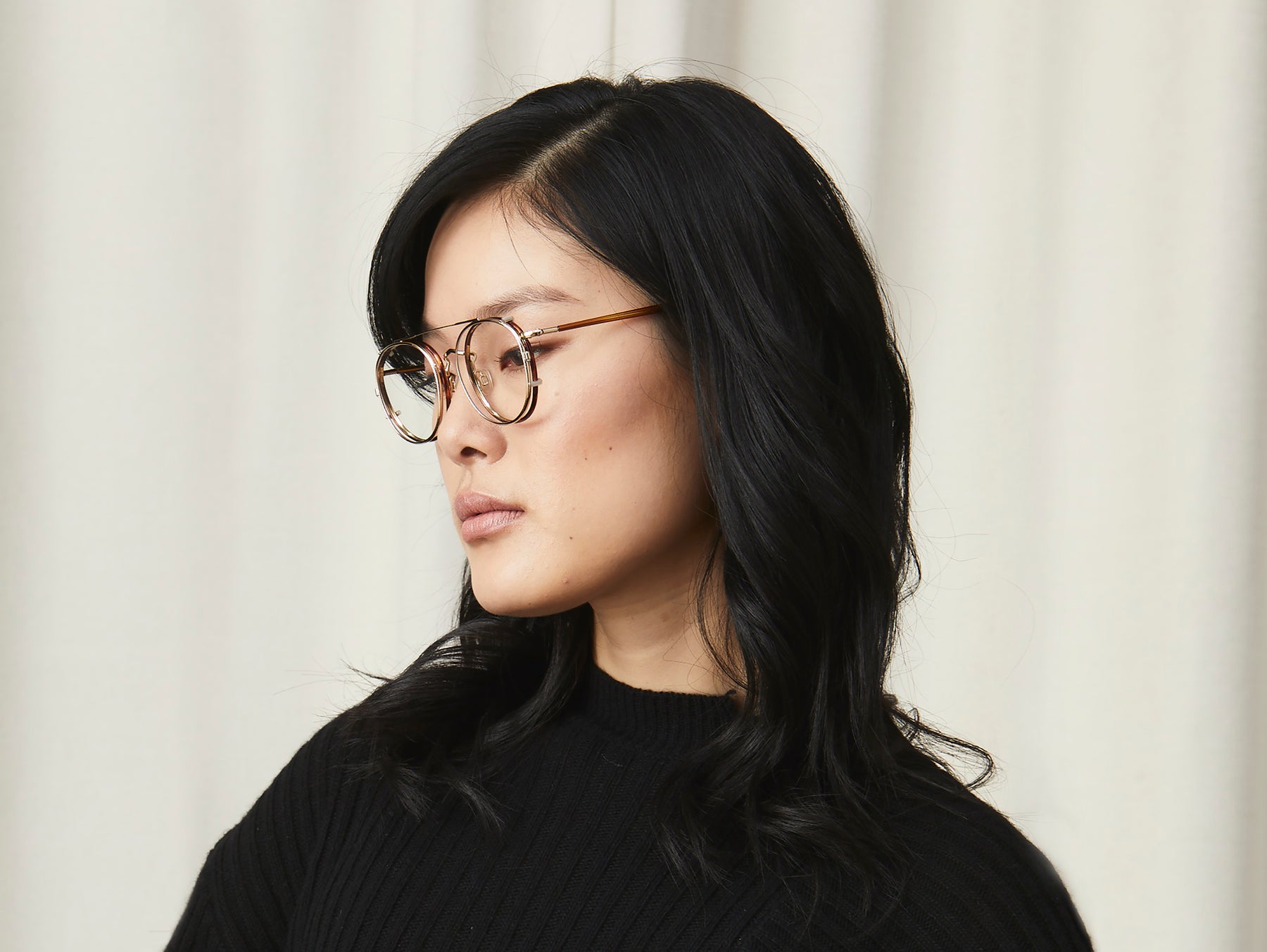 Model is wearing The ZEV CLIP in Gold in Size 49 with Blue Protect Lenses