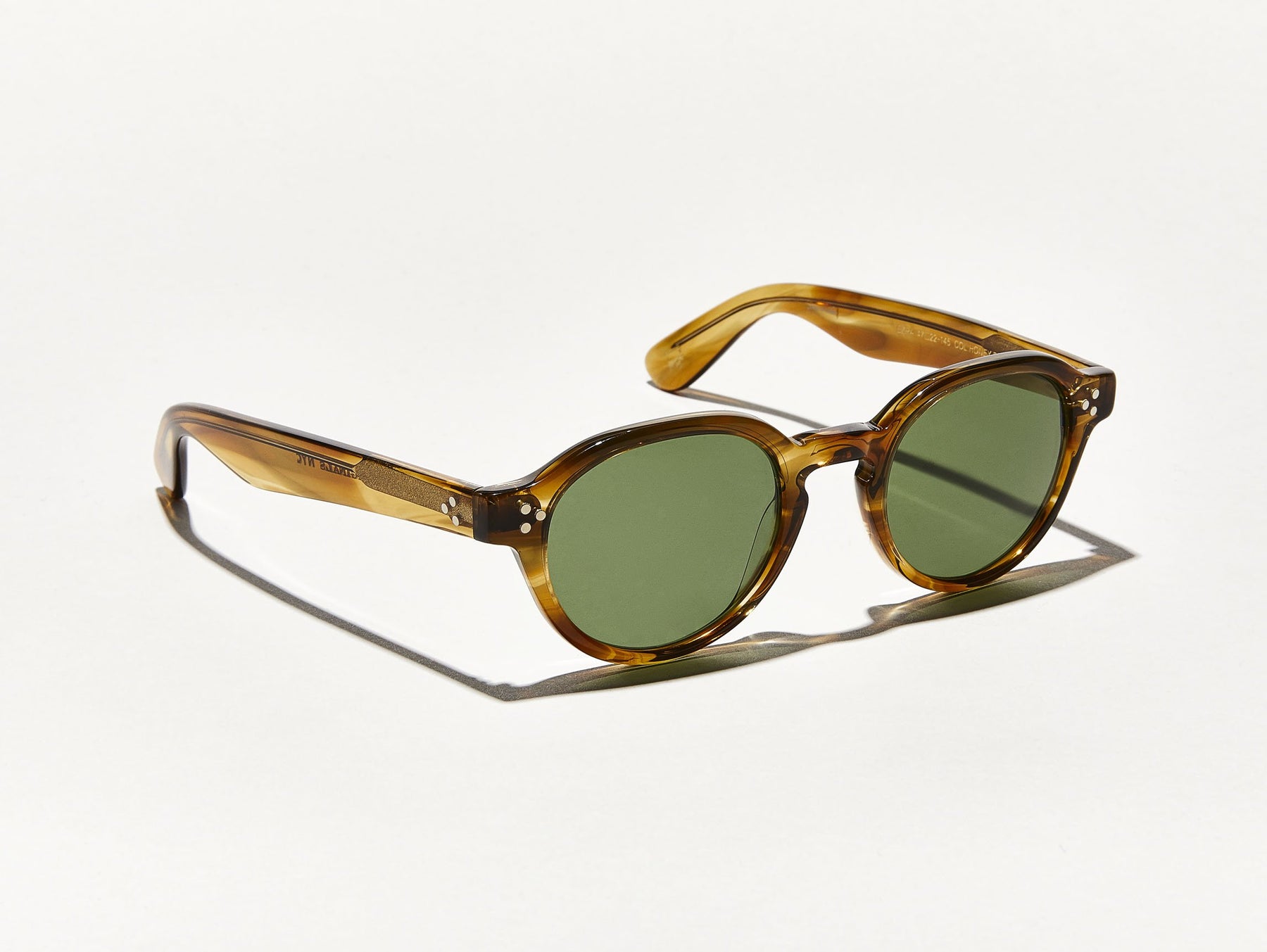 The EZRA SUN in Honey Blonde with Calibar Green Glass Lenses