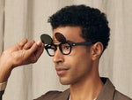 Model is wearing The FLIPTOSH in Black in size 46 with G-15 Flip Lenses