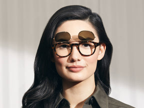 Model is wearing The FLIPTOSH in Tortoise in size 49 with G-15 Flip Lenses