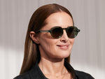 Model is wearing The FOYGEL SUN in Pine in size 46 with Green Tinted Lenses