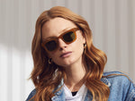 Model is wearing the FRITZ SUN in Butterscotch in size 44 with Calibar Green Glass Lenses