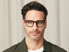 Model is wearing The GELT in Tortoise in size 46 with Blue Protect Lenses