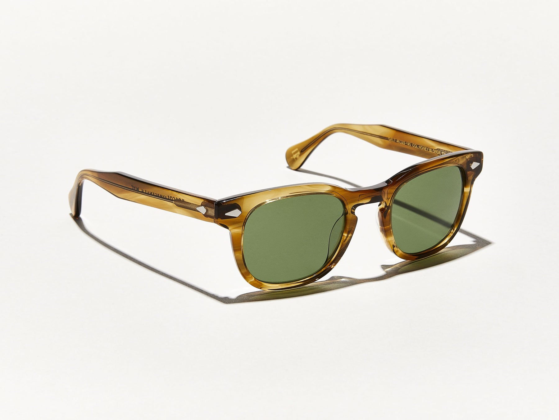 The GELT SUN in Honey Blonde with Calibar Green Glass Lenses