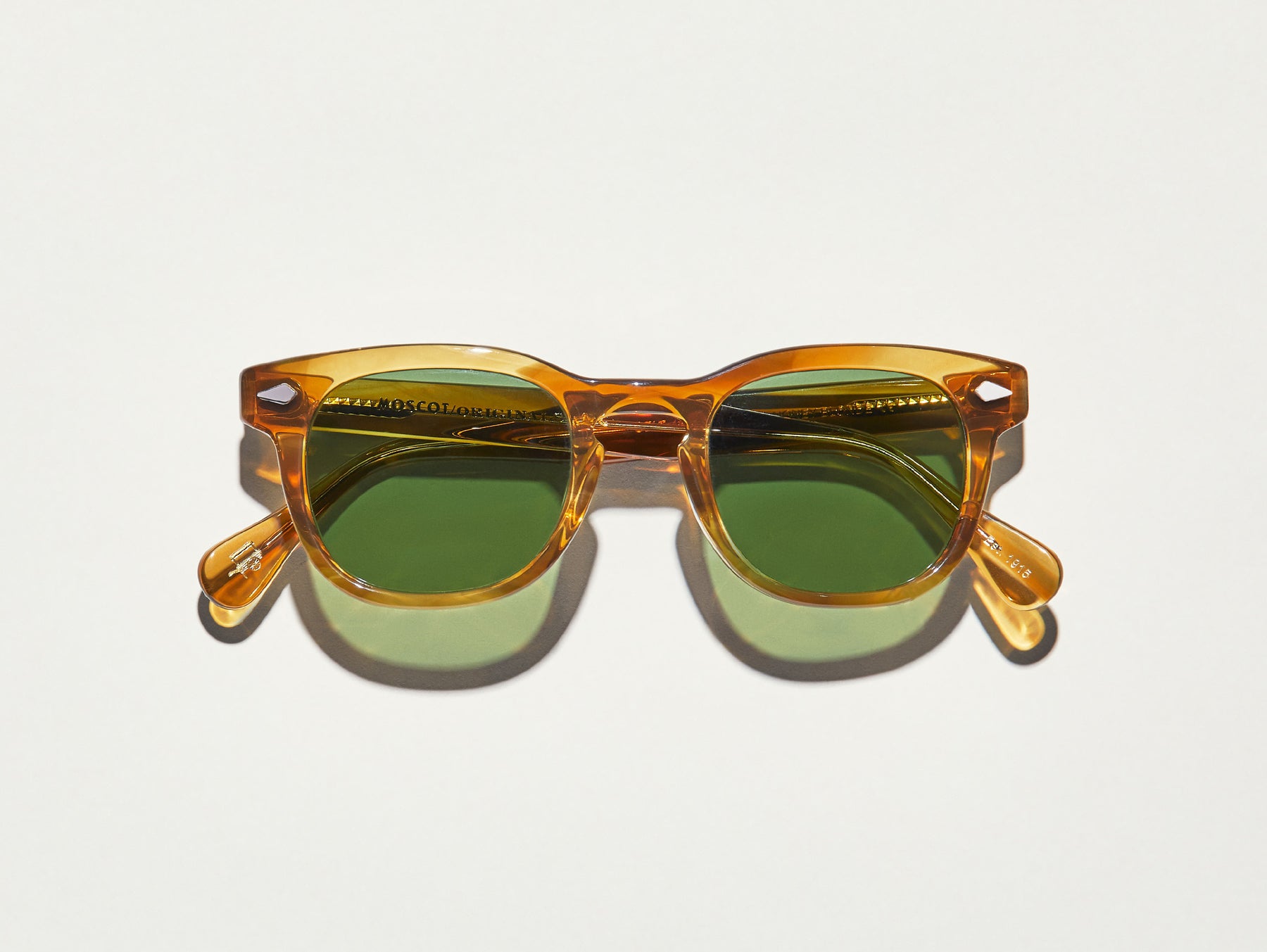 The GELT SUN in Honey Blonde with Calibar Green Glass Lenses