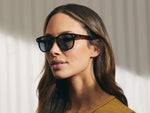 Model is wearing The GELT SUN in Tortoise in size 49 with Blue Glass Lenses