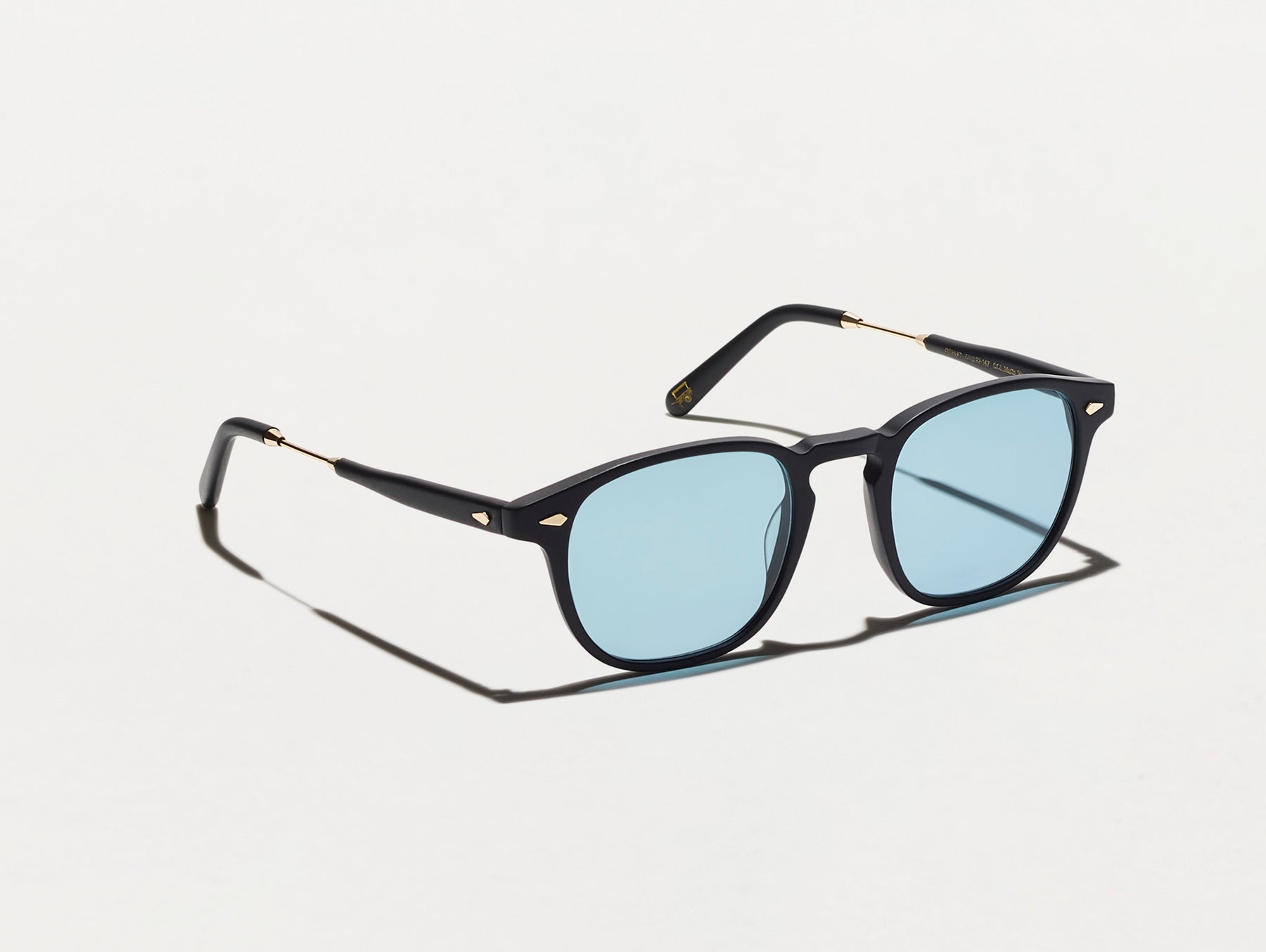 The GENUG SUN in Matte Black/Gold with DG-37 Blue Glass Lenses