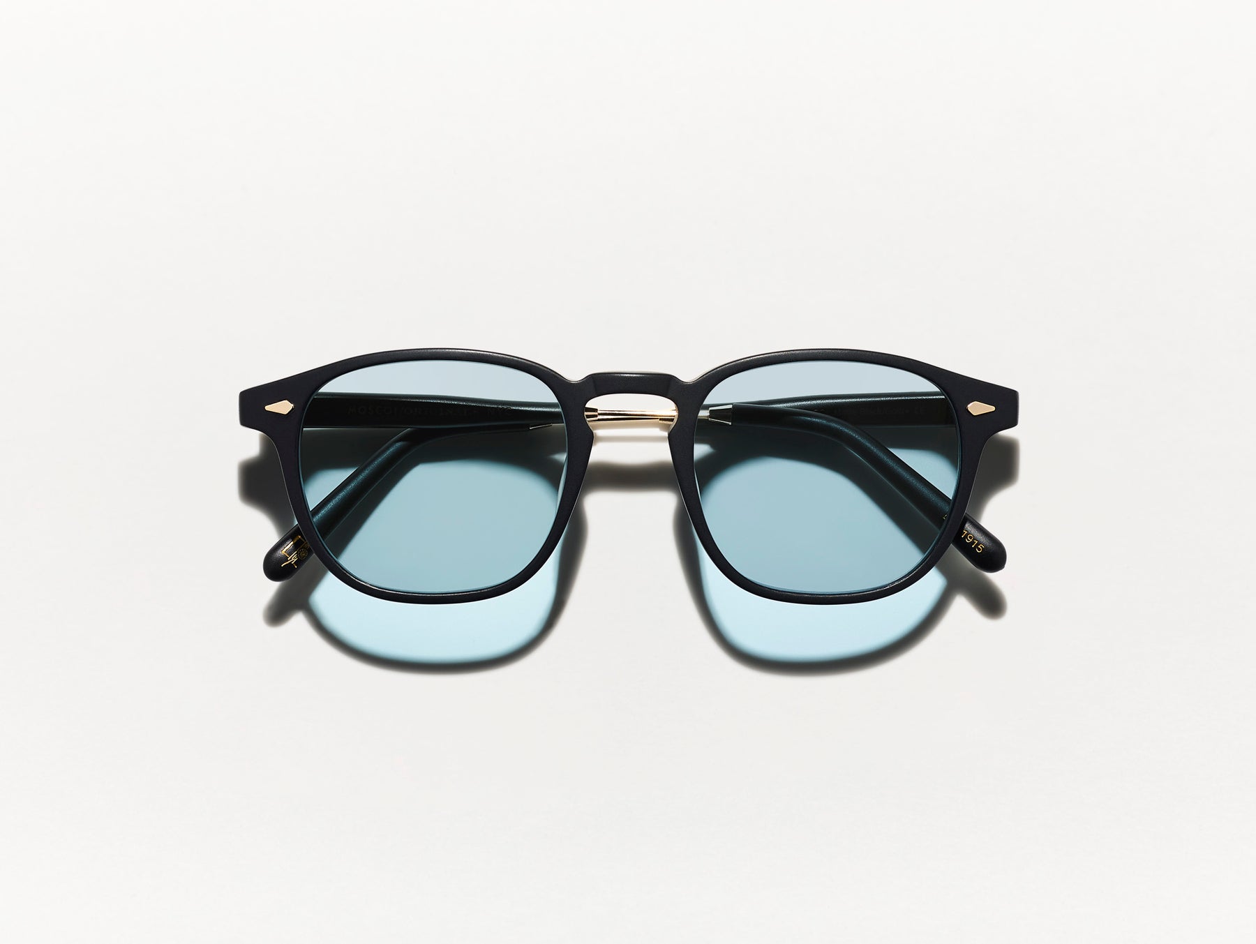 The GENUG SUN in Matte Black/Gold with DG-37 Blue Glass Lenses