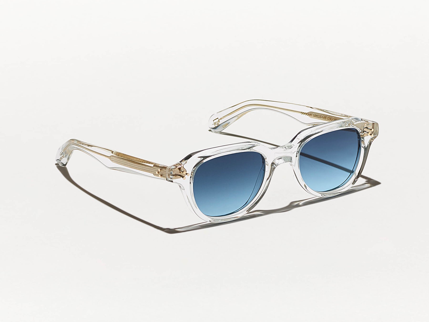 The GOOLAH SUN in Crystal with Denim Blue Tinted Lenses