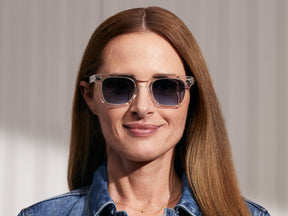 Model is wearing The GROBER SUN in Crystal in size 48 with Denim Blue Tinted Lenses