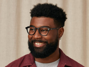 Model is wearing The KASH in size 50 in Black/Gold