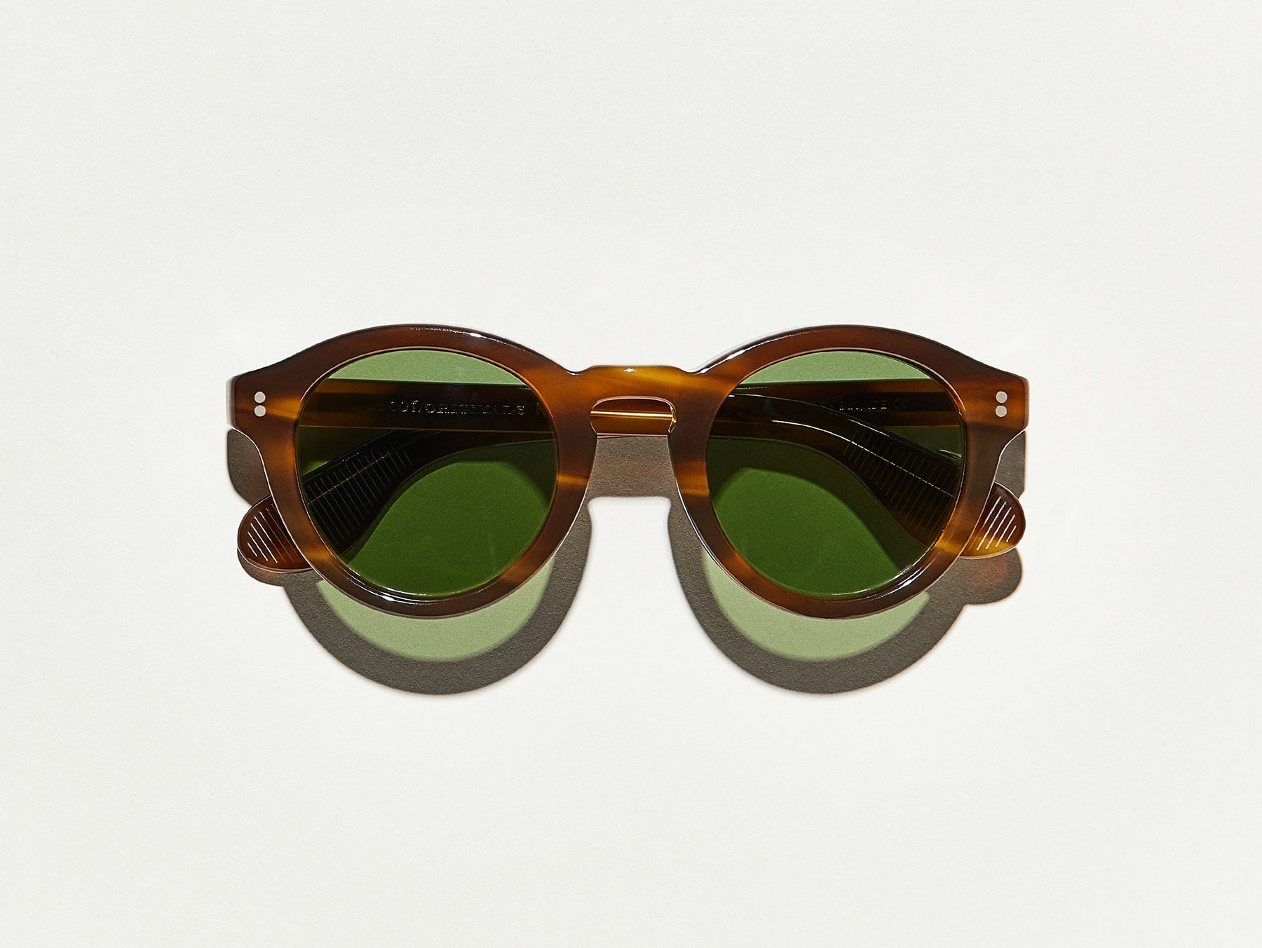 The KEPPE SUN in Dark Blonde with Calibar Green Glass Lenses