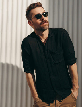 Model is wearing The KLUG SUN in Black/Silver in size 52 with G-15 Glass Lenses