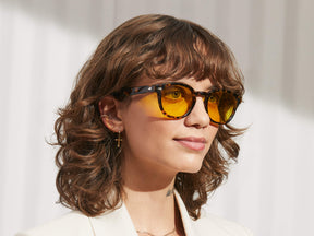 Model is wearing The LEMTOSH in Tortoise in size 49 with Mellow Yellow Tinted Lenses