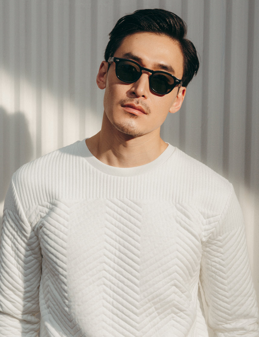 Model is wearing The LEMTOSH FOLD in Black in size 46 with G-15 Glass Lenses