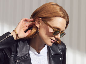 Model is wearing The LEMTOSH SUN in Blonde in size 46 with Calibar Green Glass Lenses