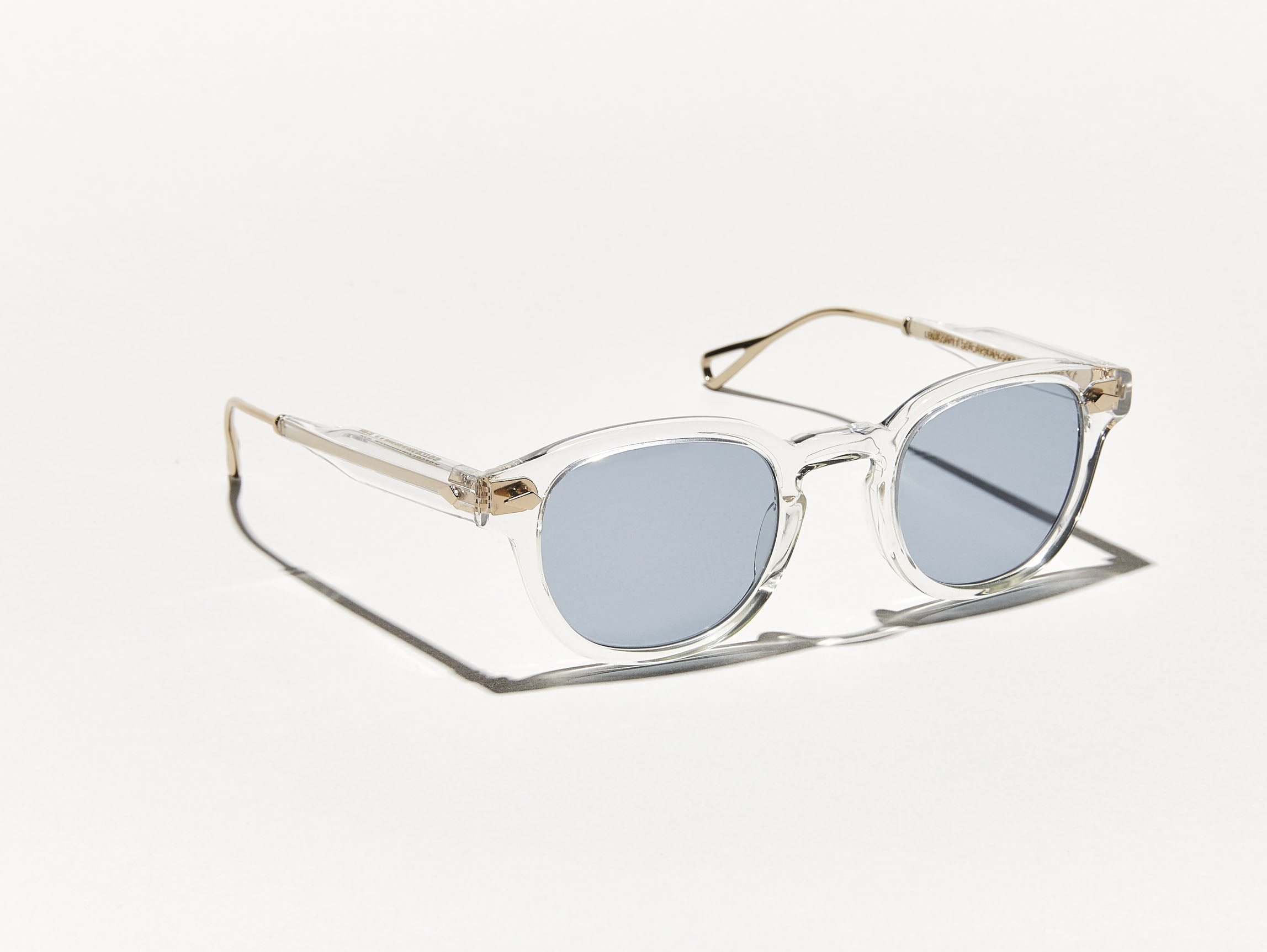 The LEMTOSH-TT SE in Crystal/Gold with Blue Glass Lenses
