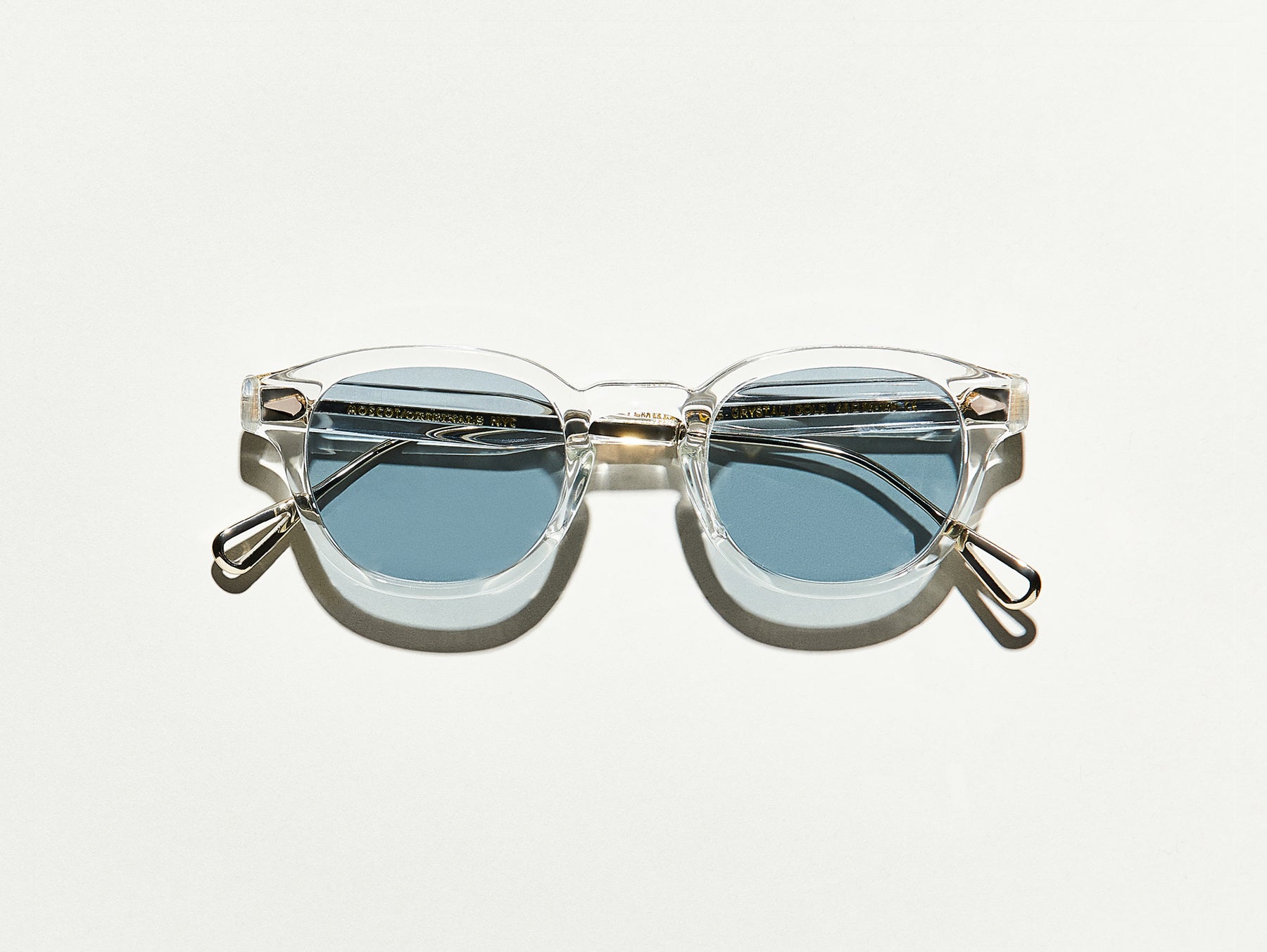 The LEMTOSH-TT SE in Crystal/Gold with Blue Glass Lenses