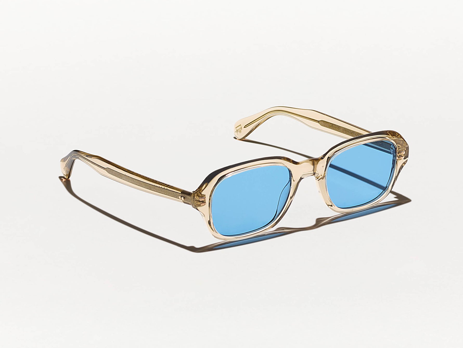 The MESHUG SUN in Cinnamon with Celebrity Blue Tinted Lenses