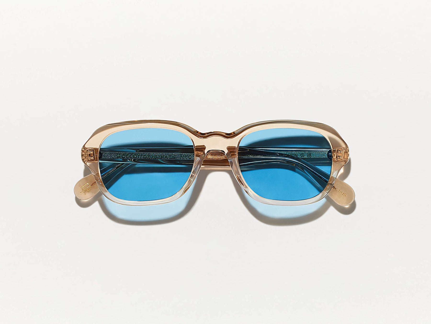 The MESHUG SUN in Cinnamon with Celebrity Blue Tinted Lenses