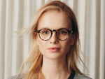 Model is wearing The MILTZEN in Classic Havana in size 49 with Blue Protect Lenses