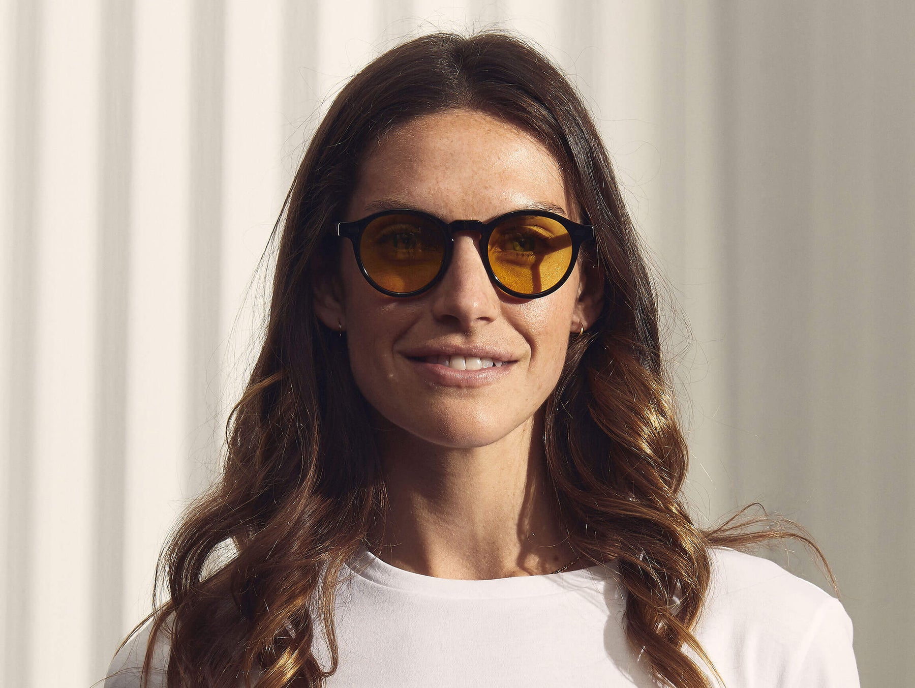 Model is wearing The MILTZEN in Black in size 46 with Mellow Yellow Tinted Lenses