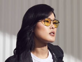 Model is wearing The MISH SUN in Black in size 51 with Yellow Glass Lenses
