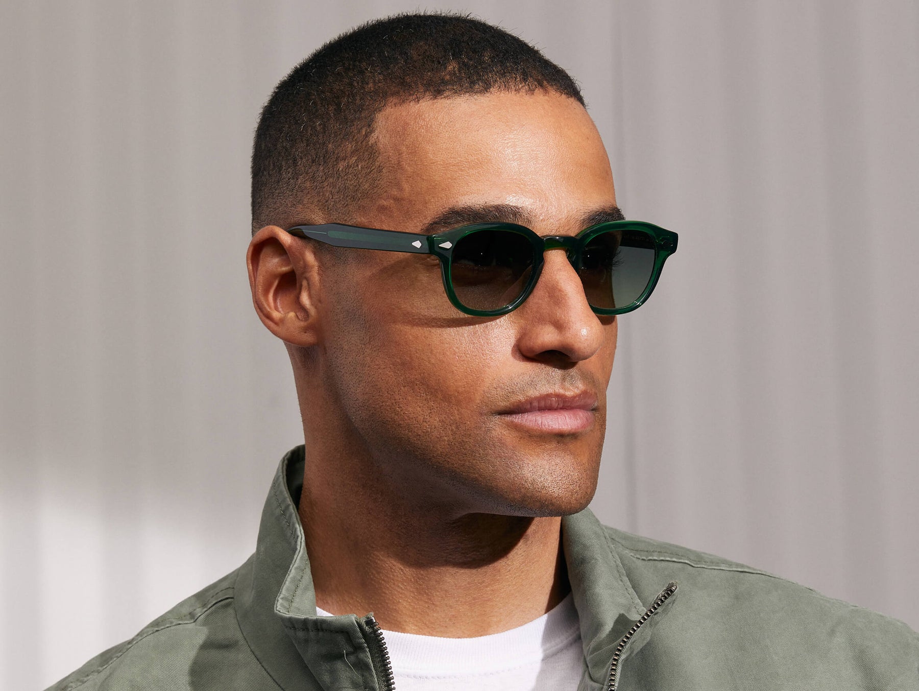 Model is wearing The LEMTOSH in Emerald in size 46 with Forest Wood Tinted Lenses