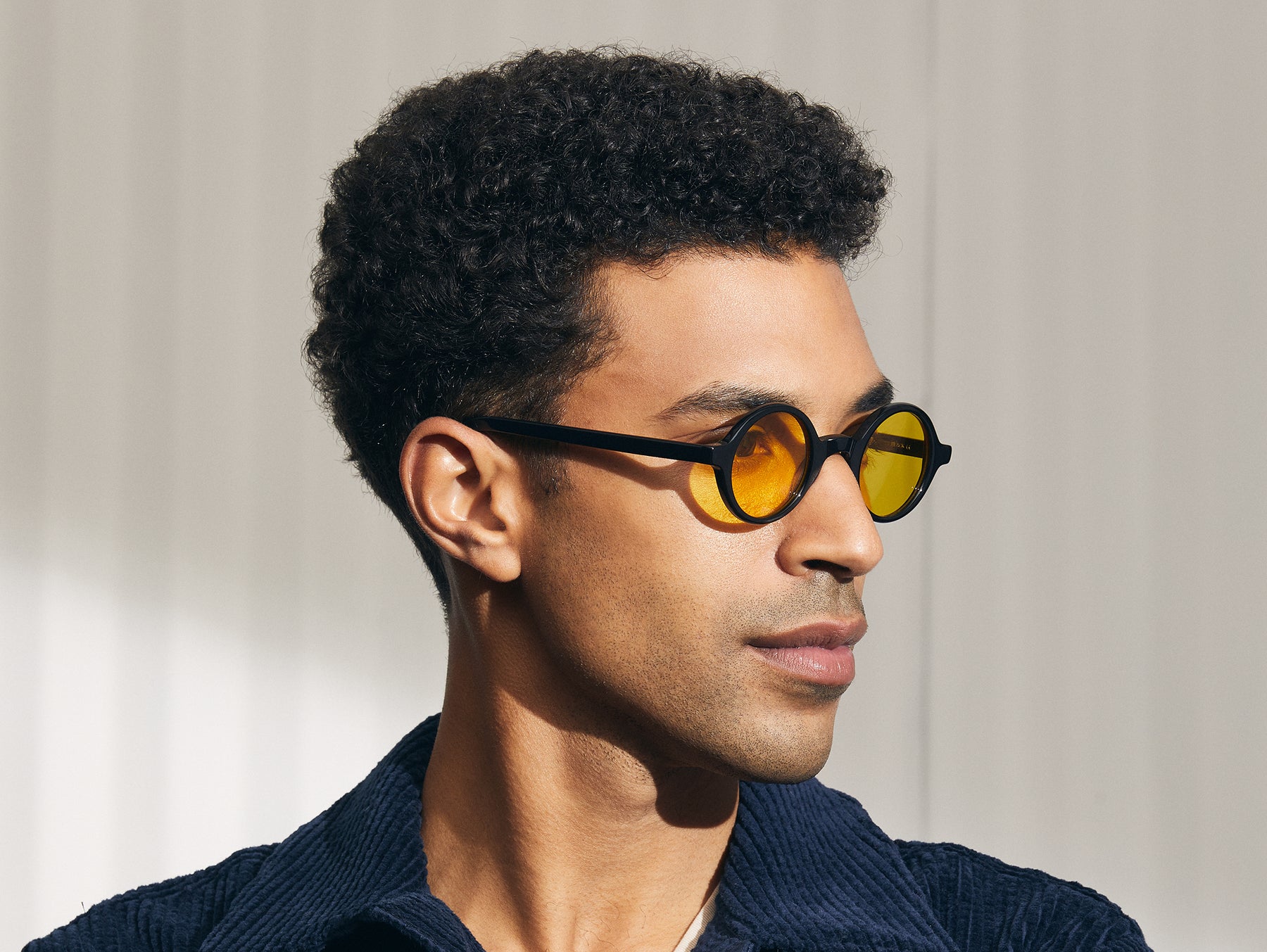Model is wearing The ZOLMAN in Black in size 42 with Mellow Yellow Tinted Lenses