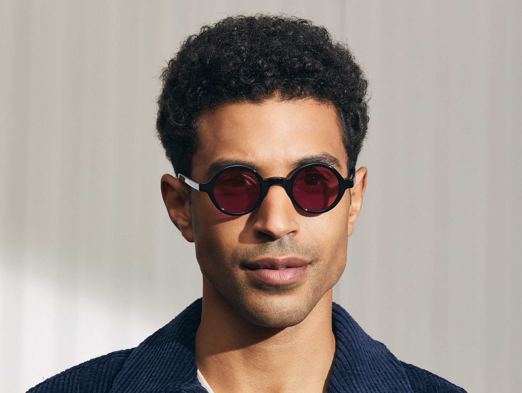 Model is wearing The ZOLMAN in Black in size 42 with Purple Nurple Tinted Lenses