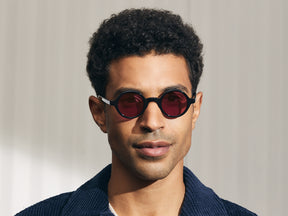 Model is wearing The ZOLMAN in Black in size 42 with Purple Nurple Tinted Lenses