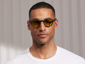 Model is wearing The LEMTOSH in Matte Black/Yellow in size 46 with Mellow Yellow Tinted Lenses