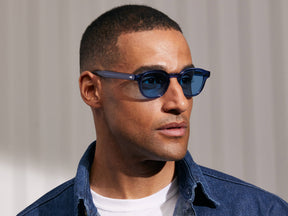 Model is wearing The LEMTOSH in Sapphire in size 46 with Celebrity Blue Tinted Lenses