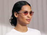 Model is wearing The LEMTOSH in Blush in size 46 with New York Rose Tinted Lenses