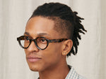 Model is wearing The GREPS in size 44 in Tortoise