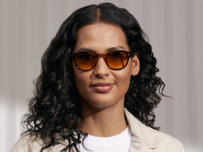 Model is wearing The LEMTOSH in Tobacco in size 46 with Chestnut Fade Tinted Lenses