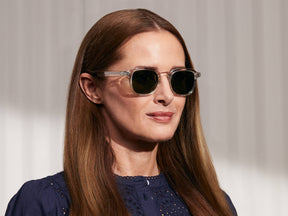 Model is wearing The MOMZA SUN in Crystal in size 49 with G-15 Glass Lenses