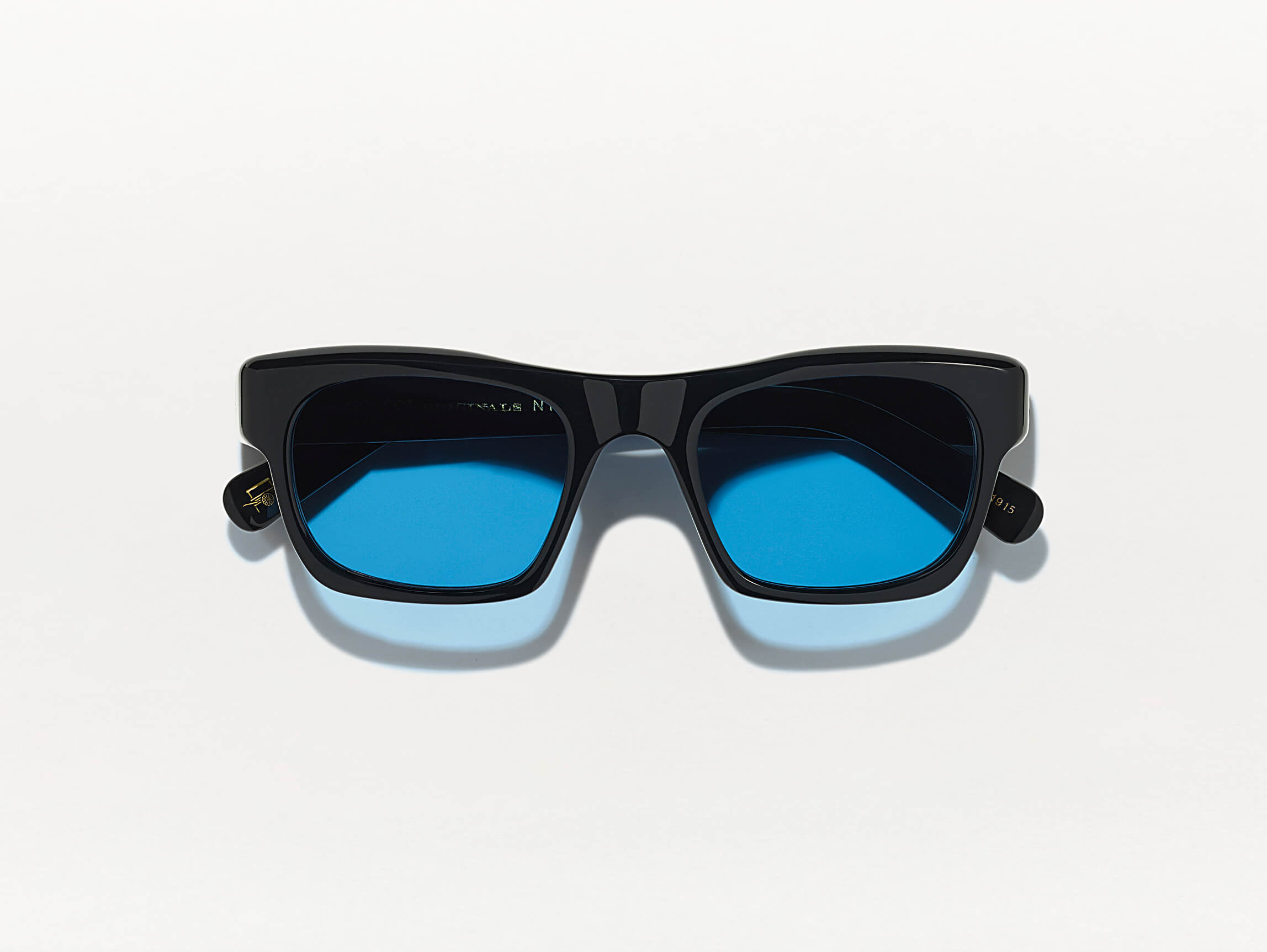 #color_black | The NUDNIK SUN in Black with Celebrity Blue Tinted Lenses