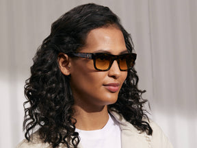 Model is wearing The NUDNIK SUN in Tortoise in size 50 with Amber Tinted Lenses