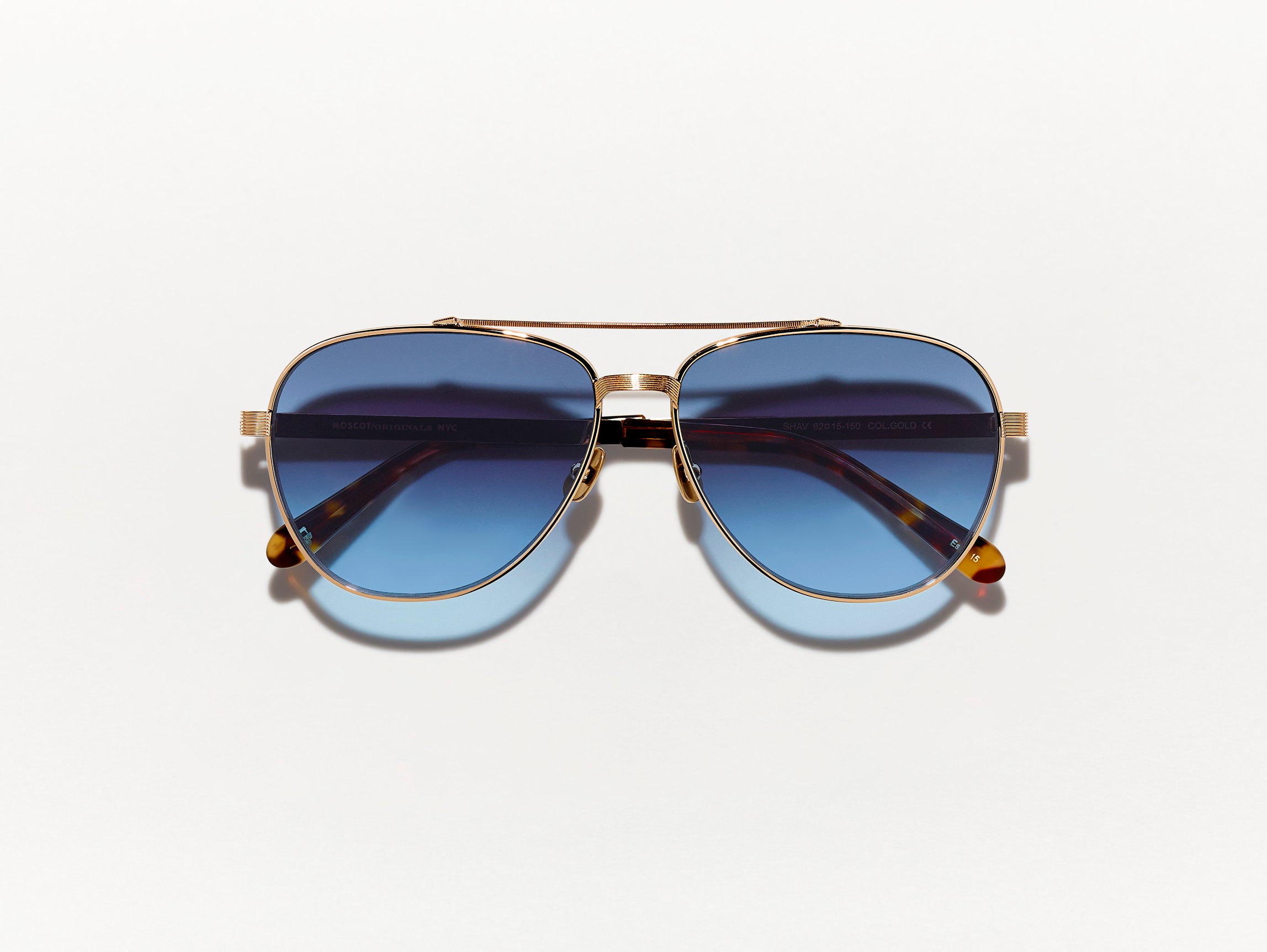 #color_gold | The SHAV SUN in Gold with Denim Blue Tinted Lenses