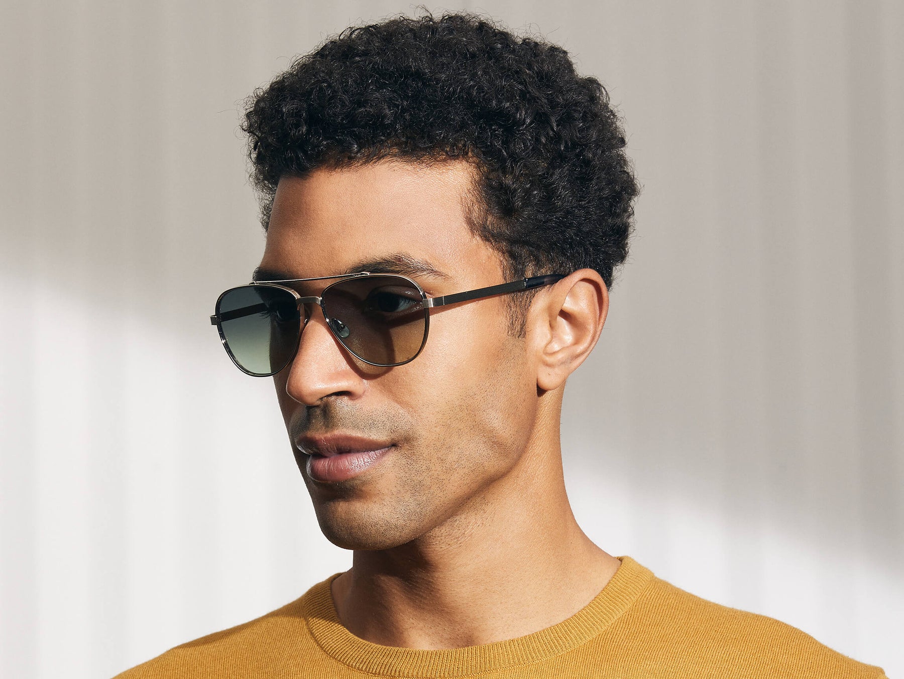 Model is wearing The SHAV SUN in Silver in size 59 with Forest Wood Tinted Lenses