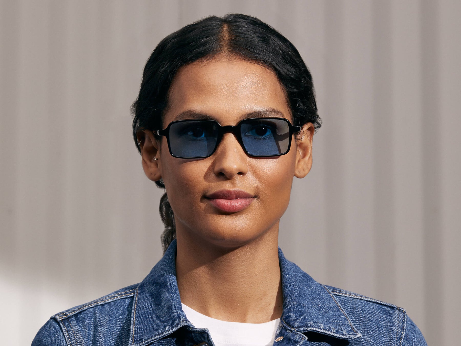 Model is wearing The SHINDIG Black in size 50 with Celebrity Blue Tinted Lenses