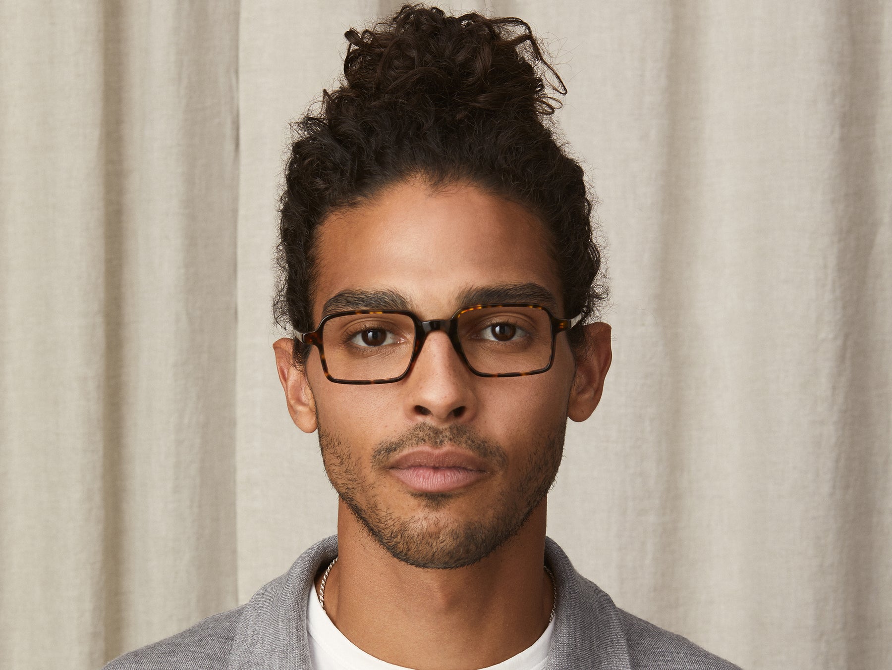 Model is wearing The SHINDIG in size 50 in Tortoise